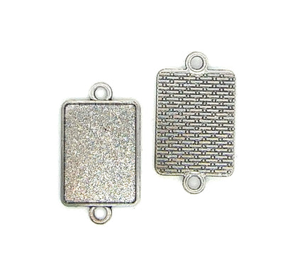  silver rectangular connector pendants with textured surface on the back 